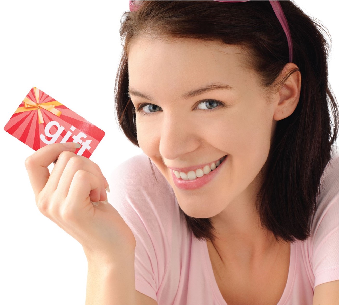 Lady with brunette hair smiling and holding a Gift Card in her hand.